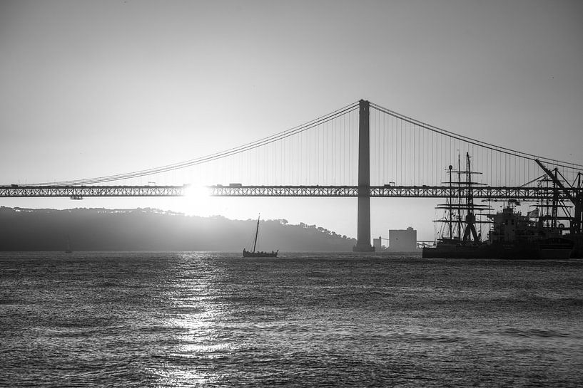the port of Lisbon at sunset by Leo Schindzielorz