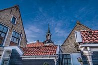 Zonsondergang in Makkum boven de daken van het stadje par Harrie Muis Aperçu