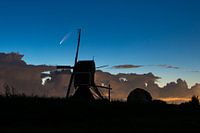 Comet above Dutch windmill