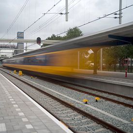 The train thunders in by John Van der Kaap
