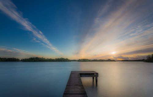 Sunset at a jetty by Koos de Wit