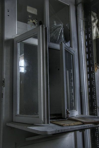 Old window at an abandoned office by Melvin Meijer