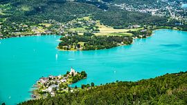 A view of the churches of Maria Woerth on Lake Woerthersee in Austria. by Andreas Völkel