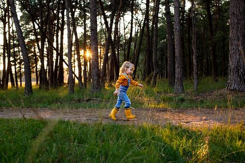 Little girl with yellow boots