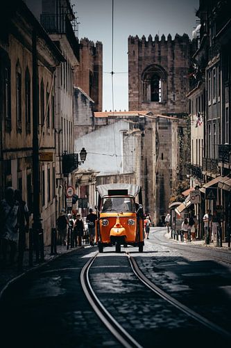 Tuk Tuk driving on the street in Lisbon, Portugal.