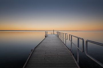Dive into the silent sunset from the jetty by Claire van Dun
