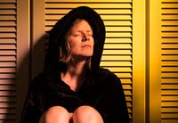 Portrait of a thirty year old attractive woman in a bedroom with