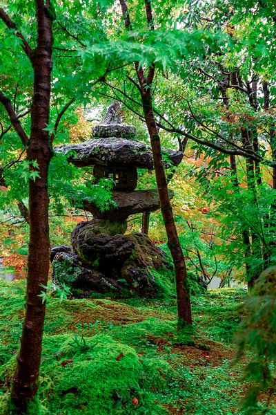 Stone lantern between the trees. by Mickéle Godderis