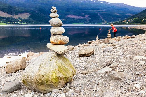 Stone man or cairn along the bank of the Vangsvatnet lake