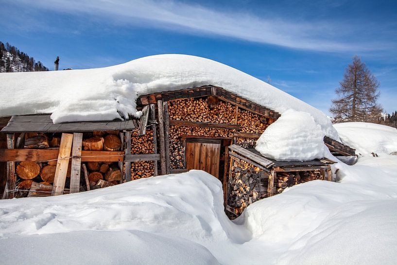 A snow-covered hut by Christa Kramer