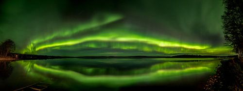 The northern lights over a lake in Finland