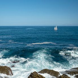 Sea with waves and a sailboat off the coast of San Sebastian by Rick Van der Poorten