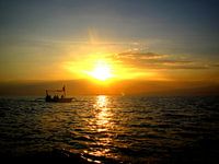 Zonsondergang aan zee