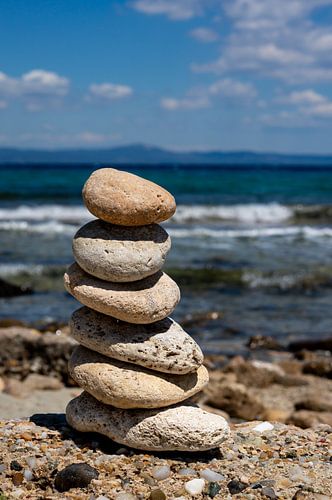 Stack of balance stones on the beach Vertical