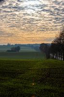 Colourful sunrise on a misty morning among the meadows in autumn
