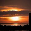 Coucher de soleil à Brouwersdam près de la jetée sur Annelies Cranendonk