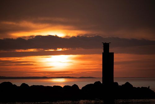 Zonsondergang aan Brouwersdam bij piertje