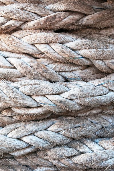 Weathered ship's rope in a shipyard by Margot van den Berg