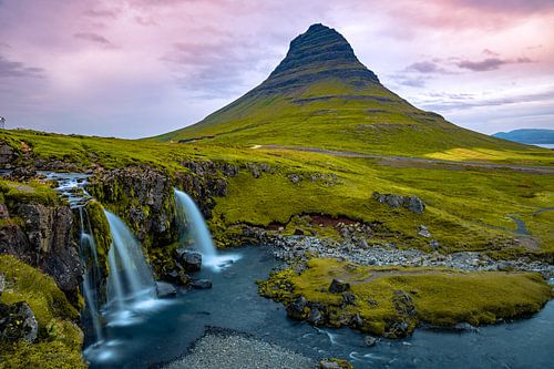 Kirkjufellsfoss waterfall and Kirkjufell mountain in Iceland
