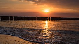 Sunset on the Baltic Sea beach by Urlaubswelt