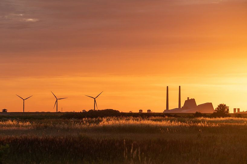 Factory with windmills at sunset. by Axel Weidner