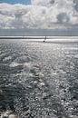 Sun over the Wadden Sea with sailing boat by Tonko Oosterink thumbnail
