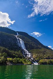 View of the Langfossen waterfall on the Åkrafjord in Norway by Rico Ködder