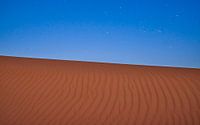Sterren boven de zandwoestijn van Jeroen Kleiberg thumbnail