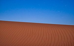 Shining stars above a sandy desert