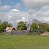 The former island of Schokland. Holland with beautiful spring clouds and blue skies, the forma by W J Kok