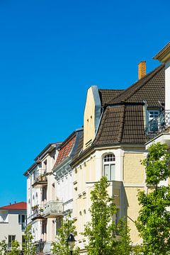 Buildings with trees in Warnemuende, Germany van Rico Ködder