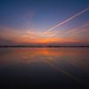 Uitzicht strand met zonsondergang van Rouzbeh Tahmassian