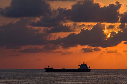 Sunset with clouds and ship