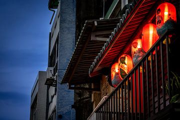 Balcony with lantern in the streets of Taiwan by Mickéle Godderis