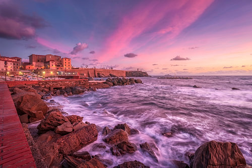 Sunset over Waves and Piazza Bovio in Piombino, Tuscany