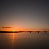 Zeeland bridge at sunset by Jan Jongejan