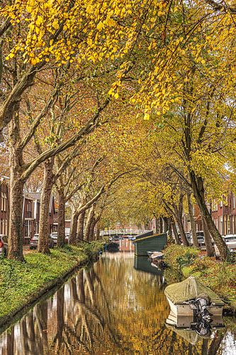 Autumn colours and a reflecting city canal in Enkhuizen in West Friesland