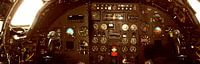 Cockpit of an older military plane as a panorama photo