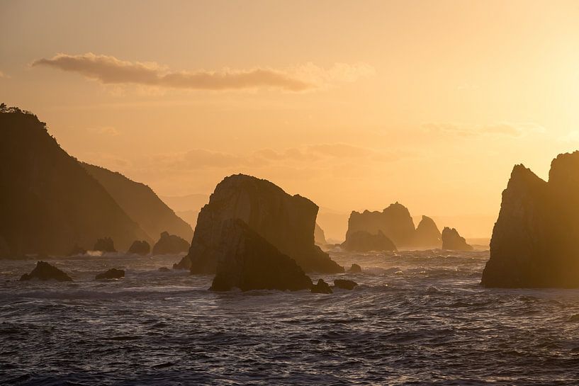 Sunset on a rugged rocky coastline by Peter Haastrecht, van
