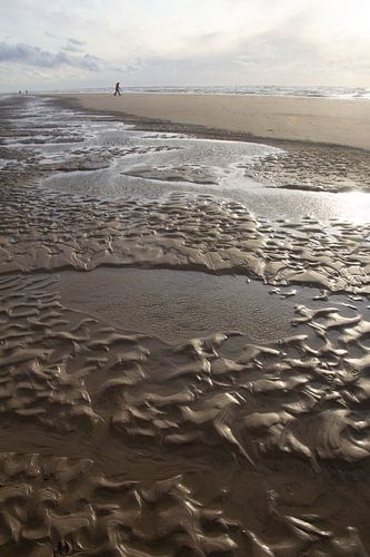 Muster im nassen Sand