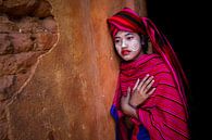 Girl sells cotton scarves at the ruins of pagodas in Myanmar Inle. She has Thanaka makeup on her fac by Wout Kok thumbnail