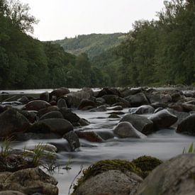 Fast flowing river by Michel Koenes