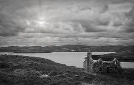 Lonely dilapidated and abandoned house in empty landscape