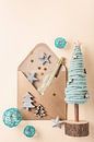 Christmas card with a brown envelope, decorative Christmas tree and other winter decorations by Iryna Melnyk thumbnail
