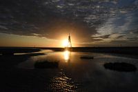 Kugelbake Cuxhaven mit aufgehender Sonne
