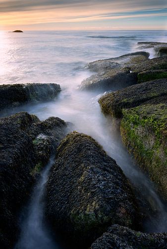 Sunset at the Opal Coast in France. With dominant rocks in the foreground. by Rob Christiaans