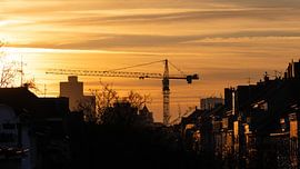Crane in the Sunset in darkest Orange - City Developement von Sebastian Czech