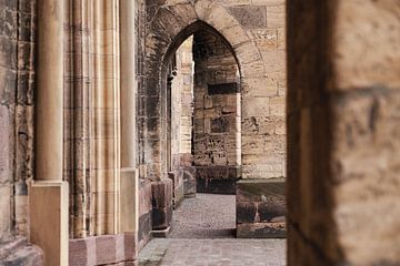 Arches under buttresses of French church in Colmar