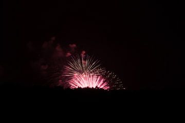 Beautiful red fireworks explosions at amazing party celebration by adventure-photos