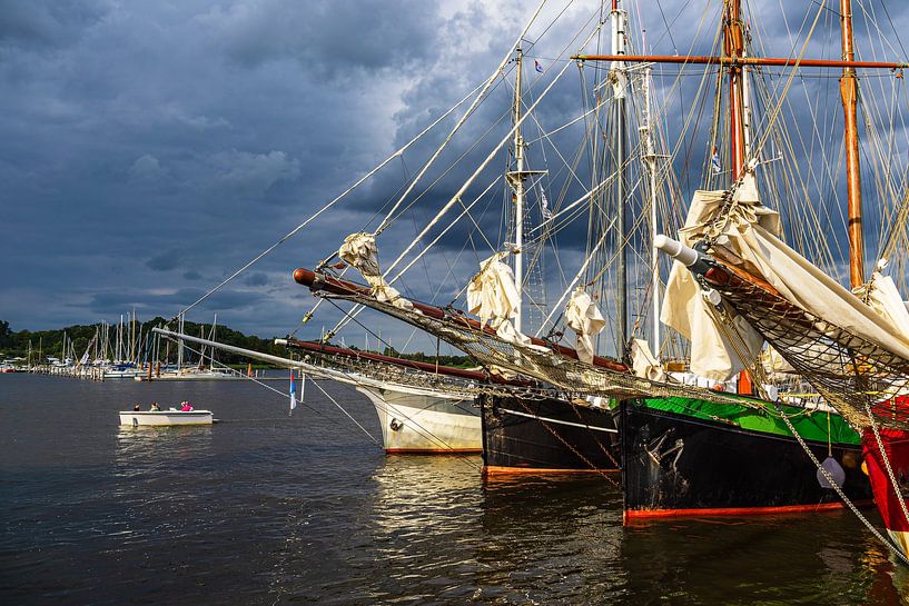 Sailing ships on the Warnow during the Hanse Sail in Rostock by Rico Ködder